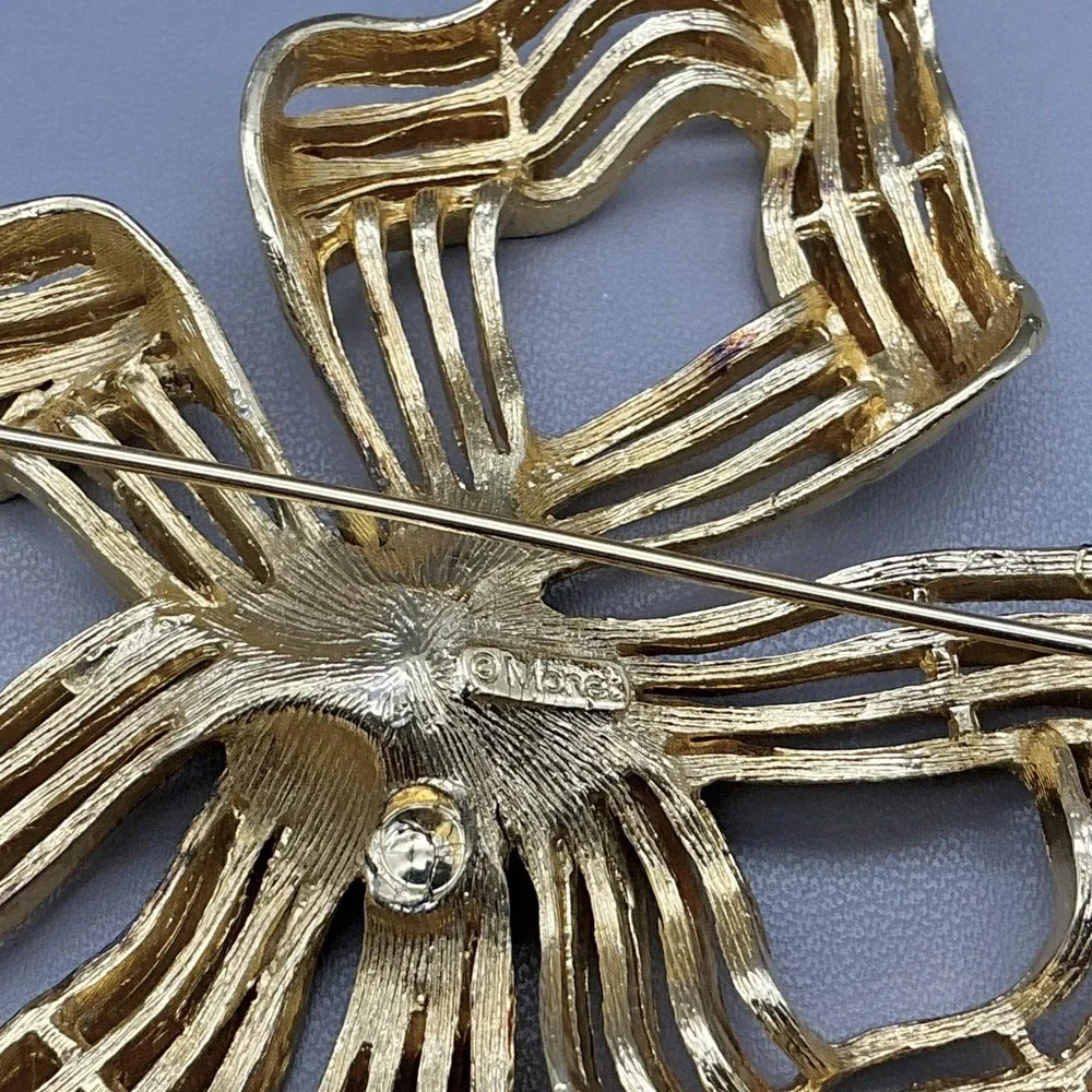 Monet Gold Tone Ribbon Bow Brooch‎ Pin Openwork Modernist Signed Costume Jewelry